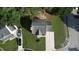 Aerial view of a cozy home with a spacious backyard and a private driveway at 5200 Fieldwood Ct, Raleigh, NC 27616