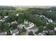Aerial view of a neighborhood featuring well-maintained homes and lush trees at 5200 Fieldwood Ct, Raleigh, NC 27616