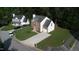 Aerial view of a two-story home in a well-maintained neighborhood with mature trees at 5200 Fieldwood Ct, Raleigh, NC 27616