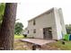 Exterior view of the back of the house featuring a sliding glass door and a wood deck at 5200 Fieldwood Ct, Raleigh, NC 27616