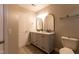 Bathroom featuring double vanity, mirrors, granite counters, and tile flooring at 5200 Fieldwood Ct, Raleigh, NC 27616