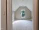 Upstairs bedroom featuring vaulted ceiling and window with lots of natural light at 5200 Fieldwood Ct, Raleigh, NC 27616