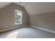 Bedroom with neutral walls, carpet flooring, and a window with a view of the outdoors at 5200 Fieldwood Ct, Raleigh, NC 27616