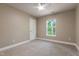 Bedroom with neutral walls, carpet flooring, a ceiling fan and a single window at 5200 Fieldwood Ct, Raleigh, NC 27616