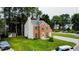 Charming two-story home with brick and siding, teal shutters, and a well-manicured lawn at 5200 Fieldwood Ct, Raleigh, NC 27616