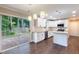 Modern kitchen with granite countertops, stainless steel appliances, and a breakfast bar at 5200 Fieldwood Ct, Raleigh, NC 27616
