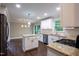 Bright kitchen featuring granite countertops, modern appliances, and an adjacent dining area at 5200 Fieldwood Ct, Raleigh, NC 27616