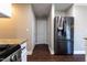 Kitchen featuring stainless steel appliances, granite counters, and wood-look floors at 5200 Fieldwood Ct, Raleigh, NC 27616