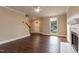 Bright living room with hardwood floors, a fireplace and a staircase at 5200 Fieldwood Ct, Raleigh, NC 27616