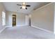Spacious main bedroom featuring an open door to a bathroom with a glass shower at 5200 Fieldwood Ct, Raleigh, NC 27616