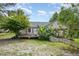 View of the backyard highlighting the patio, lush greenery, and well-maintained lawn at 559 Blue Pond Rd, Clayton, NC 27520