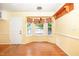 Cozy dining area featuring bay window, chandelier, hardwood floors and yellow walls at 559 Blue Pond Rd, Clayton, NC 27520