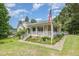 Charming single Gathering home featuring well maintained yard, landscaping and inviting front porch at 559 Blue Pond Rd, Clayton, NC 27520