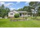 Charming single Gathering home featuring well maintained yard, landscaping and inviting front porch at 559 Blue Pond Rd, Clayton, NC 27520