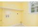 Laundry area with shelving, washer and dryer hookups and linoleum flooring at 559 Blue Pond Rd, Clayton, NC 27520