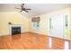 Bright living room with vaulted ceilings, fireplace, wood floors and neutral colored walls at 559 Blue Pond Rd, Clayton, NC 27520