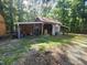A rustic barn with a metal roof, hay storage, and open sides, ideal for farm equipment or livestock at 5760 Hesters Store Rd, Hurdle Mills, NC 27541
