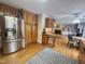 A spacious kitchen featuring stainless steel appliances, wood cabinets, and an island with seating at 5760 Hesters Store Rd, Hurdle Mills, NC 27541