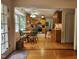 Inviting kitchen featuring wood cabinetry, stainless steel appliances, and a sunny dining nook at 5760 Hesters Store Rd, Hurdle Mills, NC 27541