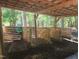 Horse stables providing shelter and comfort, featuring individual stalls and an open-air design at 5760 Hesters Store Rd, Hurdle Mills, NC 27541