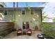 Cozy backyard patio with seating area, grill, and partial fence at 6021 Dixon Dr, Raleigh, NC 27609
