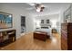 Bright bedroom features bamboo floors, ensuite bath, overhead fan and natural light at 6021 Dixon Dr, Raleigh, NC 27609