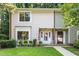 Charming home with a well-manicured lawn, an American flag, and a welcoming front porch at 6021 Dixon Dr, Raleigh, NC 27609