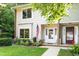 Charming exterior view of a two-story home with a well-kept lawn and an inviting front door at 6021 Dixon Dr, Raleigh, NC 27609