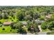 Aerial view of the home nestled among lush trees, showcasing its serene setting and generous lot size at 620 Red Carriage Ave, Durham, NC 27704