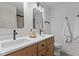 Modern bathroom with double sinks, updated vanity, and a large mirror at 620 Red Carriage Ave, Durham, NC 27704