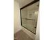 Bathroom shower with sliding door and tile details at 620 Red Carriage Ave, Durham, NC 27704