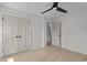 Bright bedroom features hardwood floors, a ceiling fan, and a large closet at 620 Red Carriage Ave, Durham, NC 27704