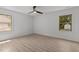 Light and airy bedroom with hardwood floors, ceiling fan, and ample natural light at 620 Red Carriage Ave, Durham, NC 27704