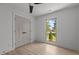 Well-lit bedroom features hardwood floors, a ceiling fan, and a closet at 620 Red Carriage Ave, Durham, NC 27704