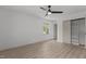 Bright bedroom with wood floors, a closet, and a view of the backyard at 620 Red Carriage Ave, Durham, NC 27704