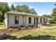 Well-maintained home with manicured landscaping, showcasing a fresh paint job and curb appeal at 620 Red Carriage Ave, Durham, NC 27704
