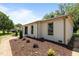 Landscaped home exterior with manicured shrubbery, and front yard at 620 Red Carriage Ave, Durham, NC 27704