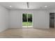 Bright living room features a sliding glass door, recessed lighting, and stylish wood-look floors at 620 Red Carriage Ave, Durham, NC 27704