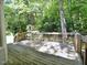 Wooden back deck overlooking a lush backyard with mature trees at 637 Shadywood Ln, Raleigh, NC 27603
