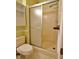 Bathroom featuring a tiled shower with glass door and toilet at 637 Shadywood Ln, Raleigh, NC 27603