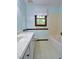 Bright bathroom featuring a vanity with a marble countertop and a window with natural light at 637 Shadywood Ln, Raleigh, NC 27603