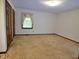 Bedroom with carpet flooring, large window, and spacious closet at 637 Shadywood Ln, Raleigh, NC 27603