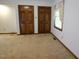 Bedroom with carpet flooring, large window, and spacious closet at 637 Shadywood Ln, Raleigh, NC 27603