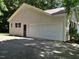Spacious garage with ample parking space and a convenient side entrance at 637 Shadywood Ln, Raleigh, NC 27603