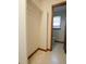 Hallway closet with access to an adjacent bathroom with a window at 637 Shadywood Ln, Raleigh, NC 27603