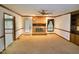 Bright living room with a fireplace, built-in bookshelves, and ceiling fan at 637 Shadywood Ln, Raleigh, NC 27603