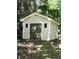 Backyard shed with double doors, providing extra storage space at 637 Shadywood Ln, Raleigh, NC 27603