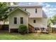 Exterior view of a two story home with a deck and outdoor seating at 713 Saint Catherines Dr, Wake Forest, NC 27587