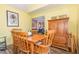 Cozy dining area with a wooden table and view into living room at 713 Saint Catherines Dr, Wake Forest, NC 27587