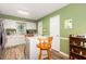 Well-lit kitchen with white cabinetry and eat-in island at 713 Saint Catherines Dr, Wake Forest, NC 27587